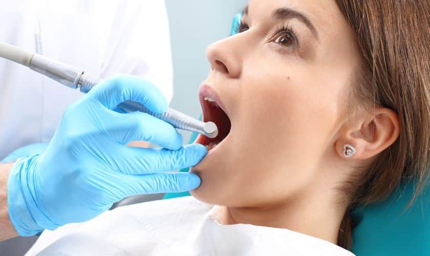 Dentist doing dental implant treatment